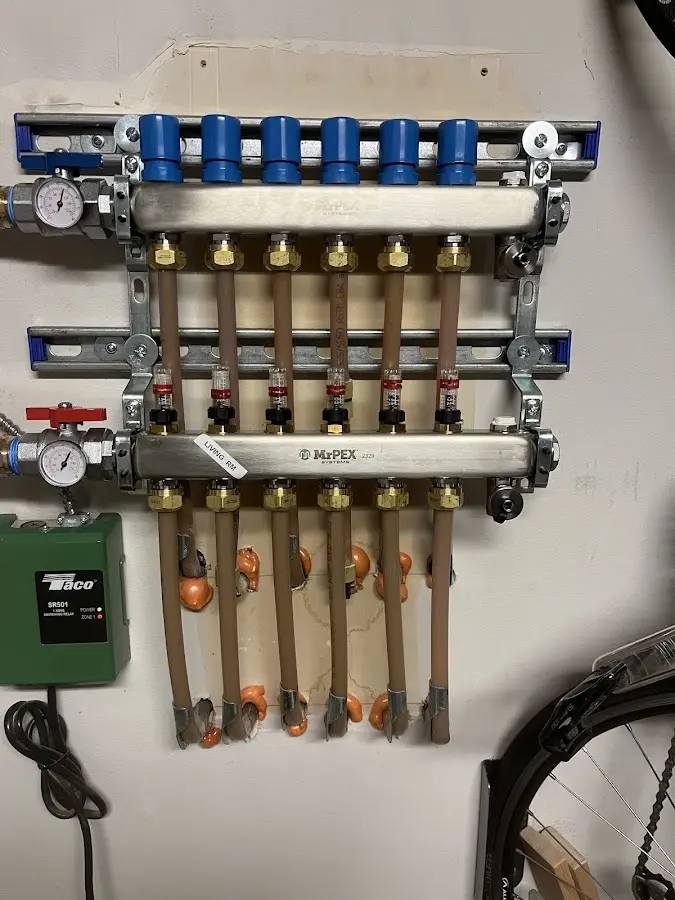 Plumber performing Water Heater Repair at a residential property in Harrison